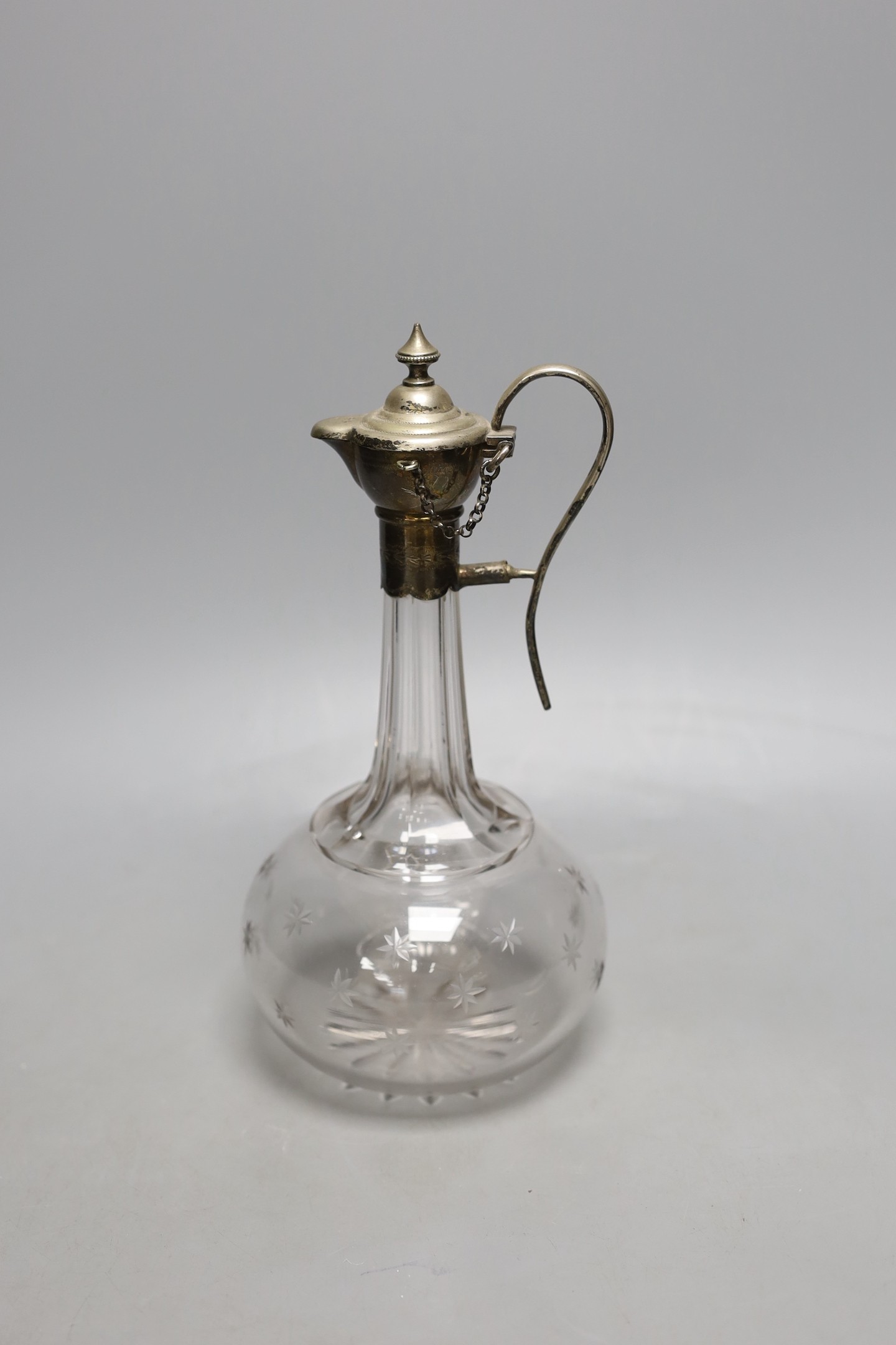 A Victorian plated mounted glass claret jug with patent designed pouring system, 25cm